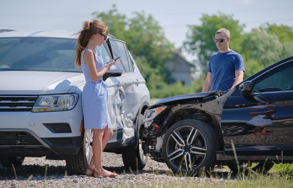 Two drivers having argument over who is guilty in car crash accident.